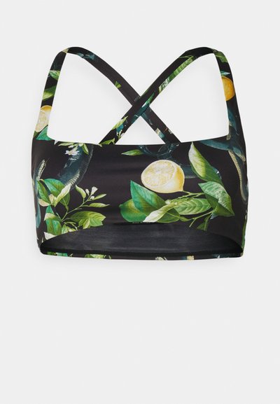 Bralette noire avec des bretelles croisées, dotée d'un motif floral vibrant de feuilles vertes et de tranches de citrus jaunes. Tissu lisse et extensible.