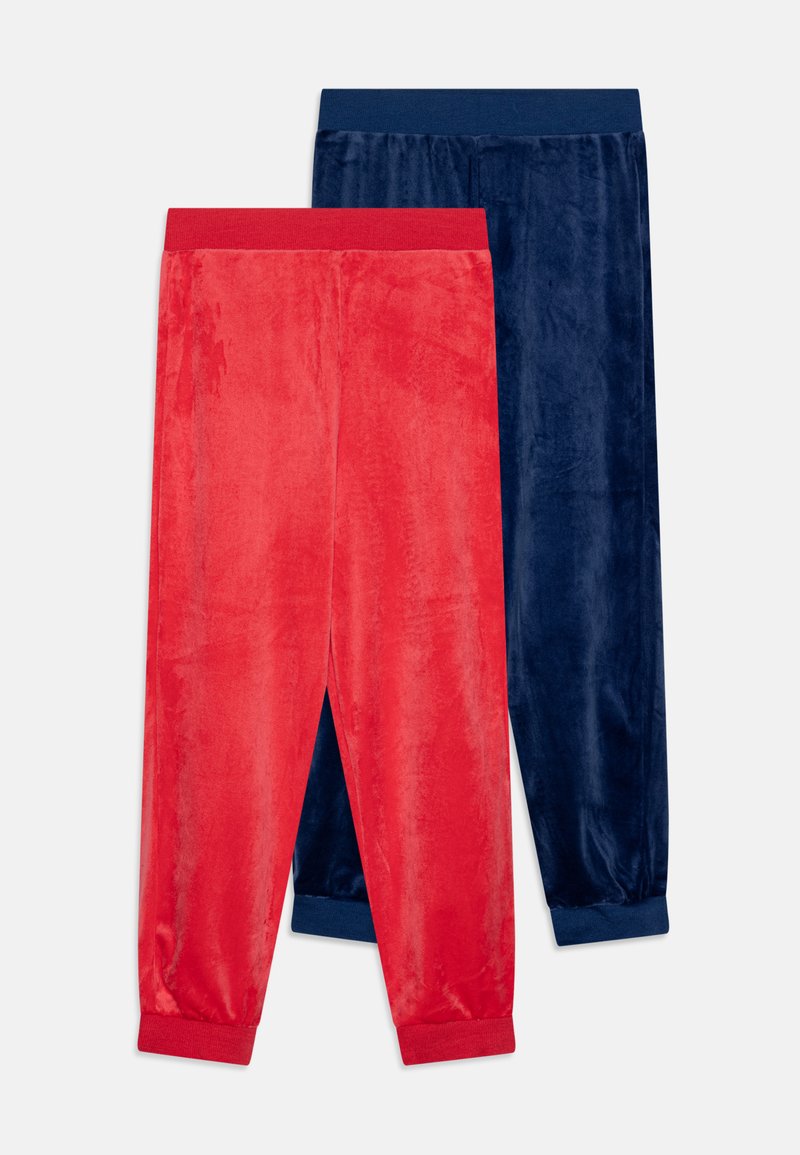 Two pairs of soft, velvety joggers: one red with a red waistband, and one dark blue with a blue waistband. Both have elastic cuffs.
