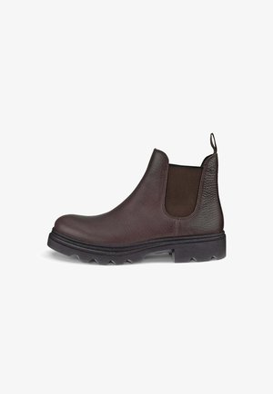 Bottines Chelsea en cuir marron avec panneaux élastiques sur les côtés, finition texturée et une semelle en caoutchouc robuste présentant un motif de grip moulé.