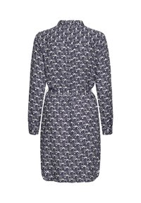 Ilga rankovė, iki kelių ilgio su tamsiai mėlyna ir balta geometrine diamanto raštu, su sutraukta juosmens juosta, matoma iš nugaros.