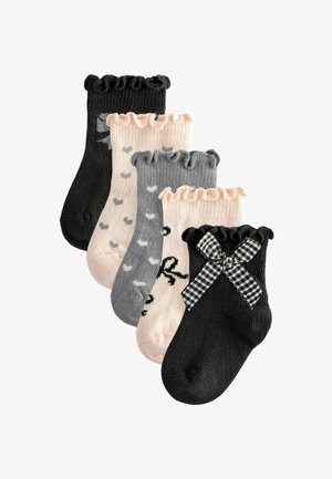 Set of five ankle socks: black, pink, and gray with ruffled tops. Patterns include polka dots and a bow accent on one sock. Cotton blend material.