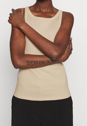 Beige ribbed tank top with a wide neckline. The fabric is smooth, fitted, and stretches to the body, featuring a clean, minimal design.