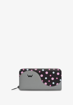 Gray and black wallet with colorful polka dots in pink and blue. Smooth texture, zip closure, and contrasting curved design details.