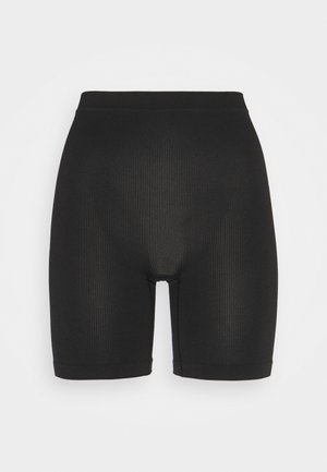 Shorts de vélo noirs à côtes avec une taille élastique, longueur à mi-cuisse et texture lisse. Sans logos visibles ni détails supplémentaires.