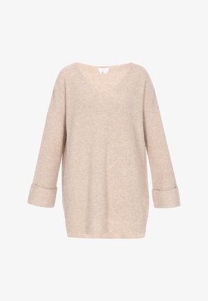 Suéter de punto beige con un corte holgado, escote en V y mangas 3/4. La tela presenta un sutil patrón texturizado y puños enrollados.