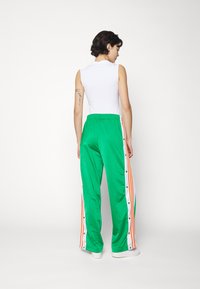 adidas Originals ADICOLOR CLASSICS ADIBREAK - Tracksuit bottoms - green