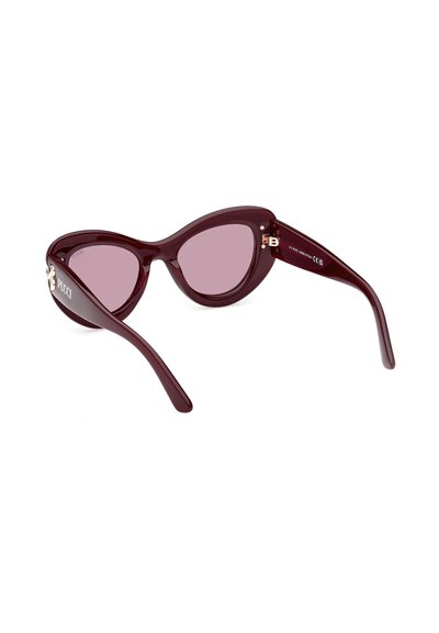 Burgundy cat-eye sunglasses with pink lenses, glossy plastic frame, gold hardware accents, and designer logo on the left temple.