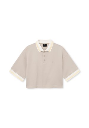 Beige cropped polo shirt with short sleeves, white and yellow striped collar and sleeve cuffs, three-button placket, and small embroidered logo.