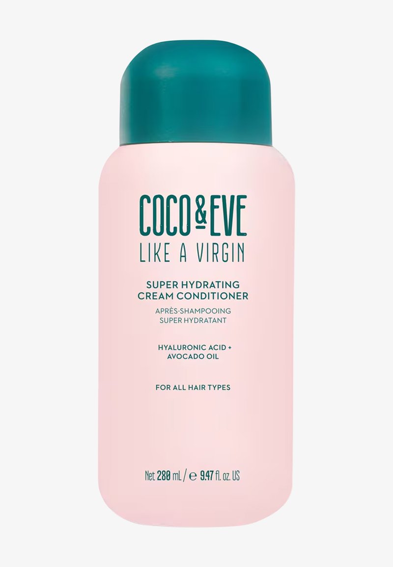Botella de acondicionador crema en plástico rosa con tapa verde azulado. Presenta una etiqueta con texto en verde oscuro que detalla los ingredientes y el uso. 288 ml.