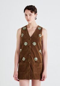 Brown suede sleeveless dress with a V-neck, floral embroidery, front buttons, and two patch pockets for added detail.