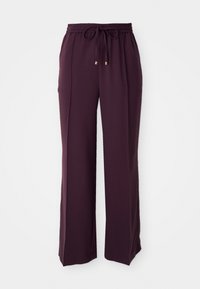 Brede pantalon in donkerpaarse stof met een elastische tailleband, verstelbaar trekkoord en subtiele gouden accenten.