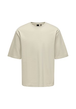 Lysebeige T-shirt med korte ærmer og rund hals, lavet af glat bomuldsstof. Har en løs pasform med ærmer i lige snit.