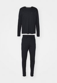 Zwarte lange mouwen top met een ronde halslijn en bijpassende zwarte joggers met een subtiel patroon, beide gemaakt van zachte, ademende stof.