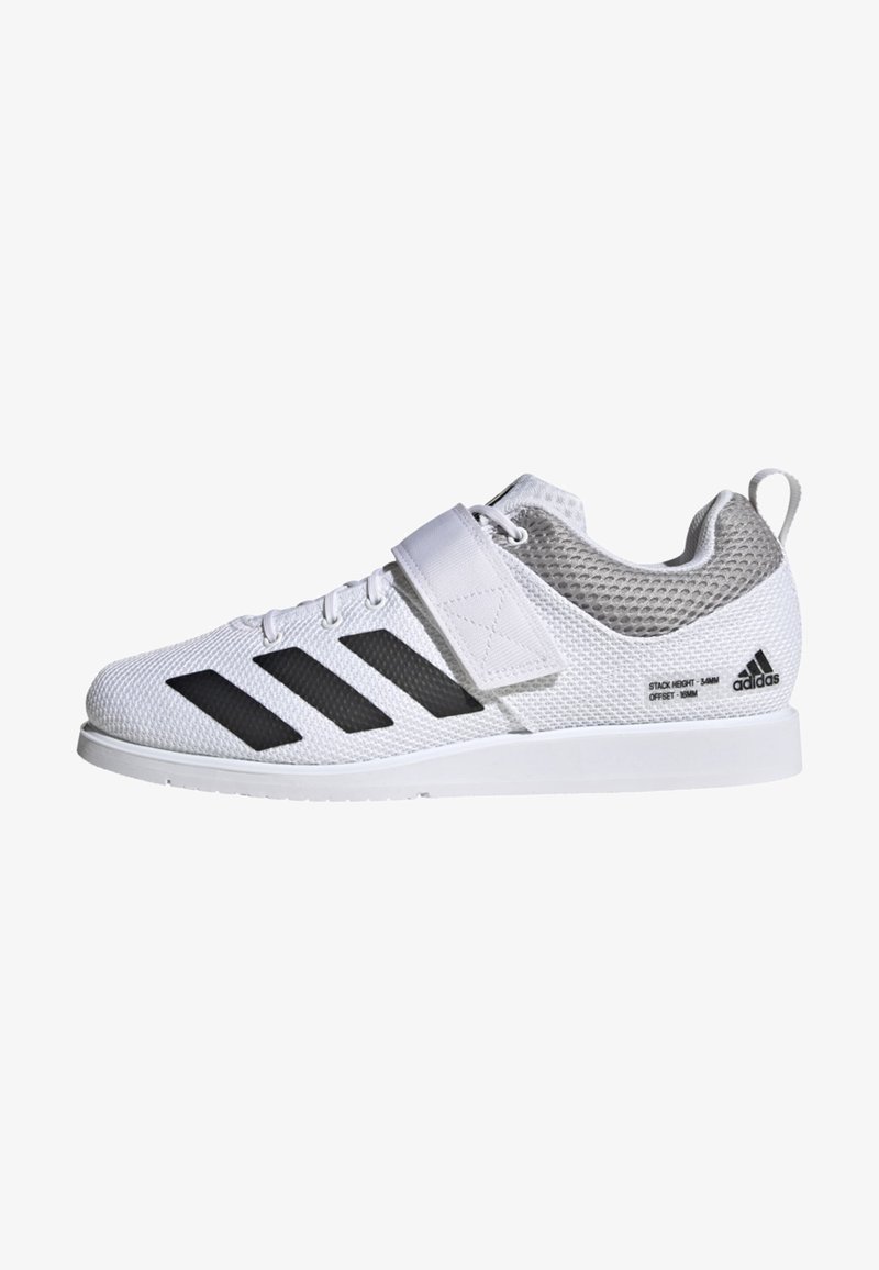Zapatilla deportiva blanca con parte superior de malla, presenta acentos de rayas negras, una correa de velcro y un contrafuerte texturizado en el talón para mayor soporte.