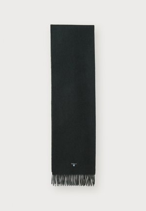 Sciarpa nera realizzata in morbido tessuto con dettagli frangiati alle estremità. Presenta un piccolo logo del marchio sul bordo inferiore. Texture liscia.