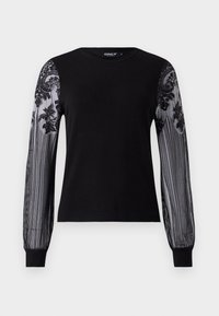 Maglione nero con lunghe maniche trasparenti e dettagli in pizzo floreale, polsini a coste e un classico collo rotondo. Tessuto morbido con finiture testurizzate.