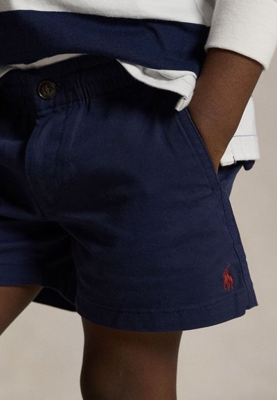 Calções de algodão azul-marinho com cintura elástica, dois bolsos laterais e um pequeno logótipo vermelho bordado na bainha.