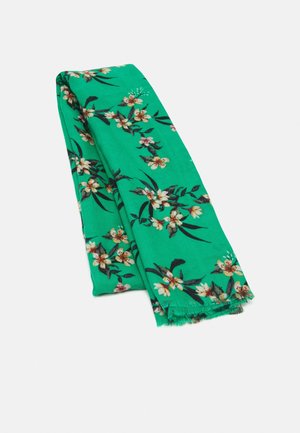 Green fabric scarf with white and yellow floral pattern, folded with fringed edges on a white background.