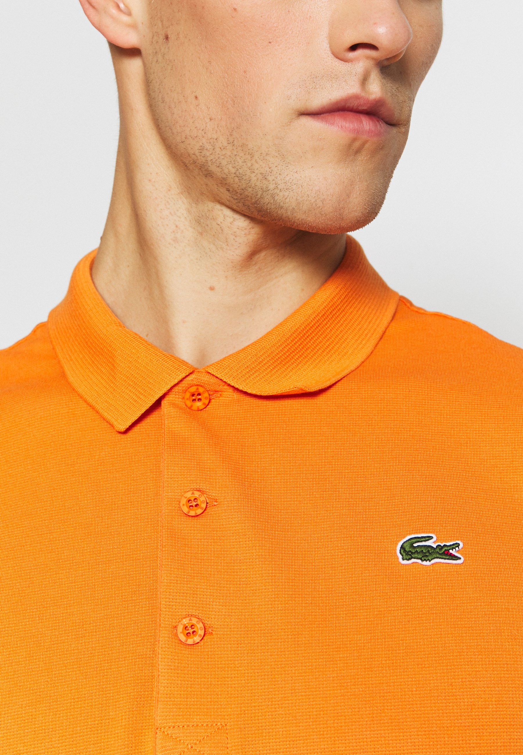 polo orange lacoste