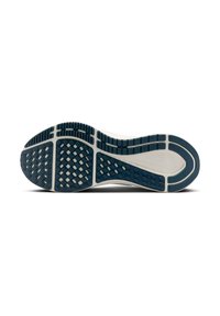 Semelle de chaussure avec une surface en caoutchouc texturé bleu foncé, présentant un motif en grille et des rainures pour l'adhérence, avec des lignes d'accentuation de couleur claire.