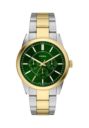 Zweisilberne und goldene Metall-Armbanduhr mit grünem Zifferblatt, goldenen Zeigern, drei Hilfszifferblättern für Tag, Datum und 24-Stunden-Anzeige sowie Fossil-Logo.