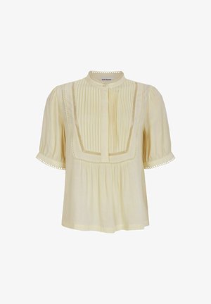 Bluză cu mânecă scurtă, de culoare galben deschis, cu față pliată, detalii din dantelă pe margini și guler rotund. Material moale, croială lejeră.