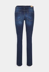 Dark blue denim jeans featuring a straight leg design, back pockets with curved stitching, and a leather waist label at the back.