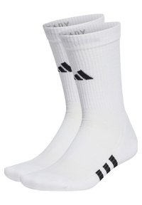 Calcetines deportivos de algodón blancos con textura acanalada, que presentan tres rayas negras en el talón y un logotipo negro en la parte frontal.