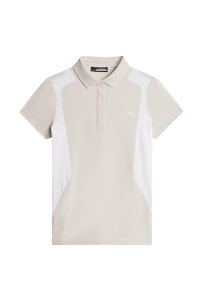 Beige pikétröja med vita sidpaneler, korta ärmar och krage. Tillverkad av ett mjukt tyg och har en liten logotyp på framsidan.