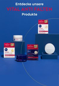 Five NIVEA Vital Anti-Falten skincare products on blue background: cream jars and boxes in white, dark blue, and red with gold accents.