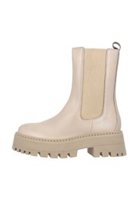 Botas de tobillo beige con un upper de cuero suave, paneles laterales elásticos y suelas de goma gruesas con un patrón de tracción dentado.