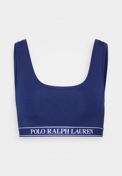 Tumši zila kokvilnas maisījuma bralete ar platām siksnām un kvadrāta veida izgriezumu, kurai apakšā ir balta logo lente ar tekstu "POLO RALPH LAUREN".
