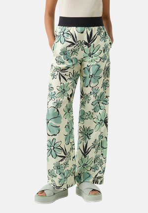 Blumenmuster weite Hosen in Mintgrün und Schwarz, aus einem weichen Stoff, mit elastischem schwarzen Bund und seitlichen Taschen.