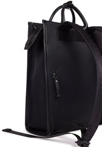 Black backpack with a smooth texture, featuring two top handles, adjustable straps, and a zippered pocket on the side.
