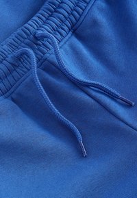 Next SLIM FIT CUFFED JOGGERS - Tepláky - light blue