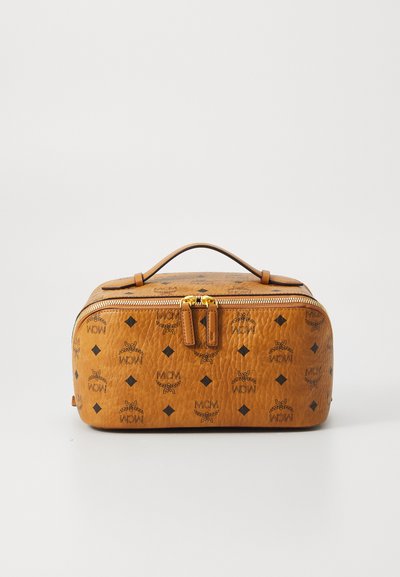 Brown leather cosmetic bag with a textured finish, featuring a gold zipper, a handle, and black logo patterns on the surface.