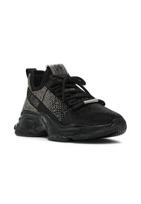 Sort atletisk sneakers med en tekstureret overdel i sølvnuancer, snørebånd og en kraftig gummisål. Glitrende detaljer på siderne.