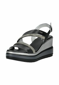 Black wedge sandals featuring crisscross straps with silver embellishments, a textured black insole, and a silver platform base.
