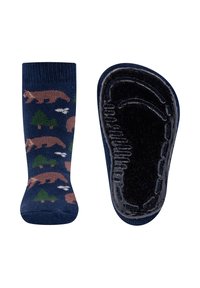 Navy socks with bear and tree patterns in beige and green. Non-slip black sole with textured grip. Soft knit material.