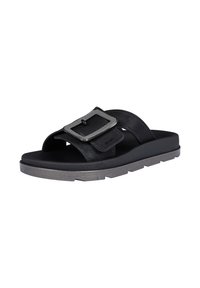 Black slide sandals featuring a textured fabric upper, a large metallic buckle accent, and a durable rubber sole with a segmented design.