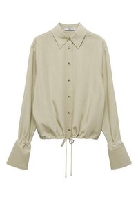 Light beige blouse made of soft fabric, featuring a pointed collar, front buttons, and gathered hem with adjustable drawstring. Flared sleeves.