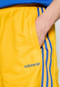 adidas Originals FOOTBALL - Treniņtērpa apakšdaļas - crew yellow