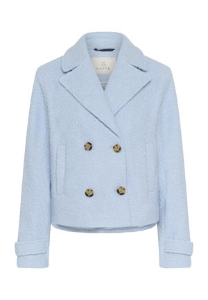 Light blue double-breasted jacket made of textured fabric featuring large bronze buttons and side pockets, with a notched collar and folded cuffs.