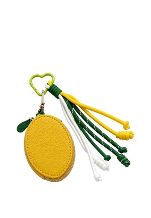 Yellow oval leather coin pouch with green zipper tab attached to green heart-shaped carabiner and green, white, and yellow decorative cords with knots.