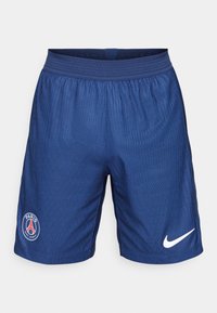 Blauwe Nike shorts met een textuurpatroon, elastische tailleband en het logo van Paris Saint-Germain op het linkerbeen. Witte Nike swoosh-accent aan de rechterkant.