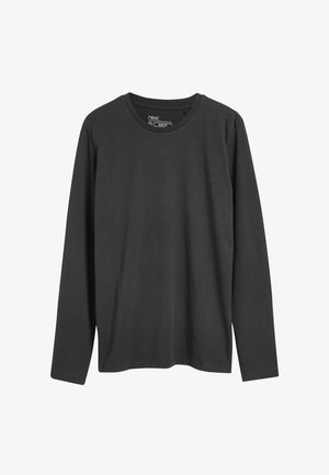 Czarna koszulka z długim rękawem wykonana z bawełny, z okrągłym dekoltem i dopasowanym krojem o gładkiej fakturze. Brak widocznych wzorów lub akcentów.