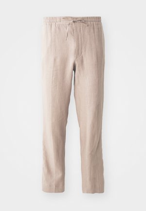 Pantalons en lin beige avec une taille élastique et un cordon de serrage. Design à jambe droite avec une texture douce et un style minimaliste.
