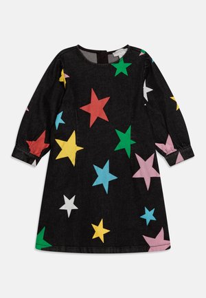 Black denim dress featuring a colorful star print in red, yellow, green, blue, pink, and white. Long sleeves and round neckline.