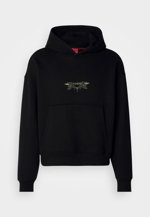 Black hooded sweatshirt with a front pocket, featuring an embroidered design that includes the word “HUGO” and decorative elements.