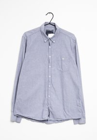 Camisa de manga larga abotonada de tejido azul claro con un bolsillo en el pecho, cuello clásico y botones blancos. Corte casual con dobladillo redondeado.
